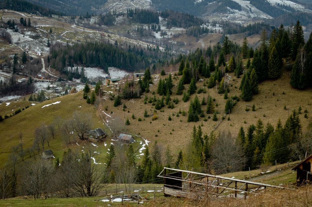 a view of a mountain with a cabin in the foreground