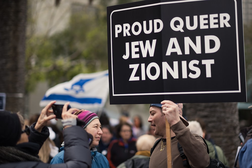 a group of people holding up a sign