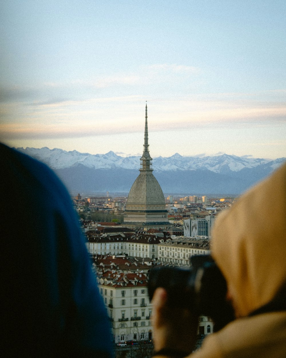 a person taking a picture of a city