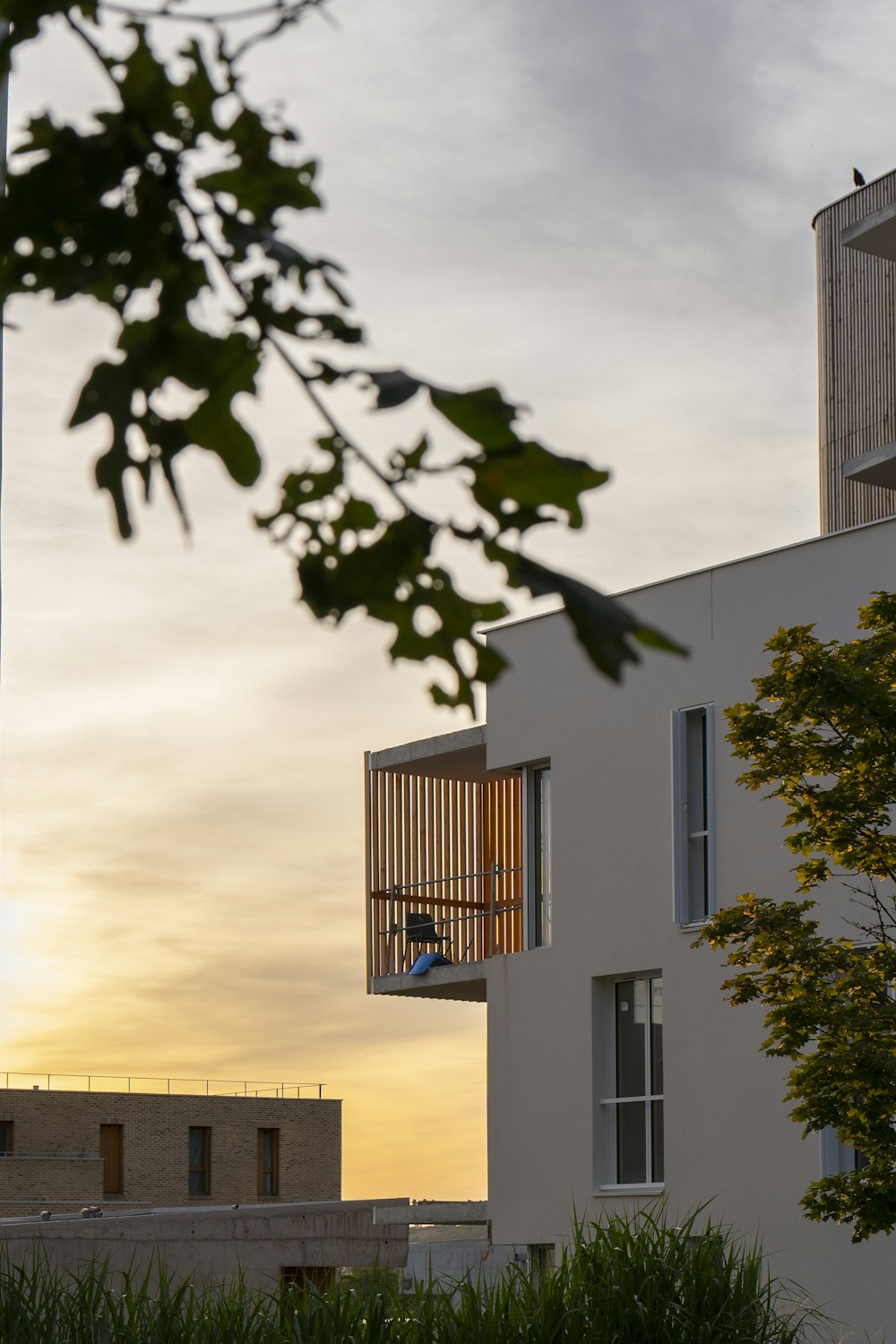 a person sitting on a balcony of a building