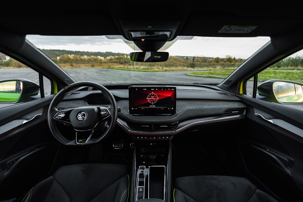 a view of the dashboard of a car from the driver's seat