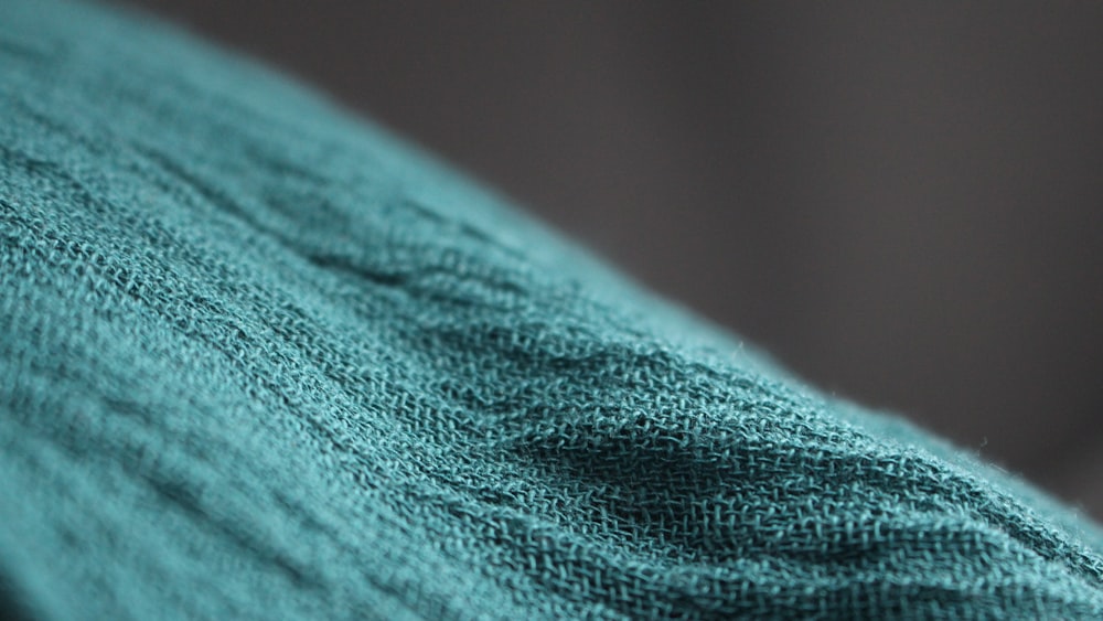 a close up view of a blue sweater