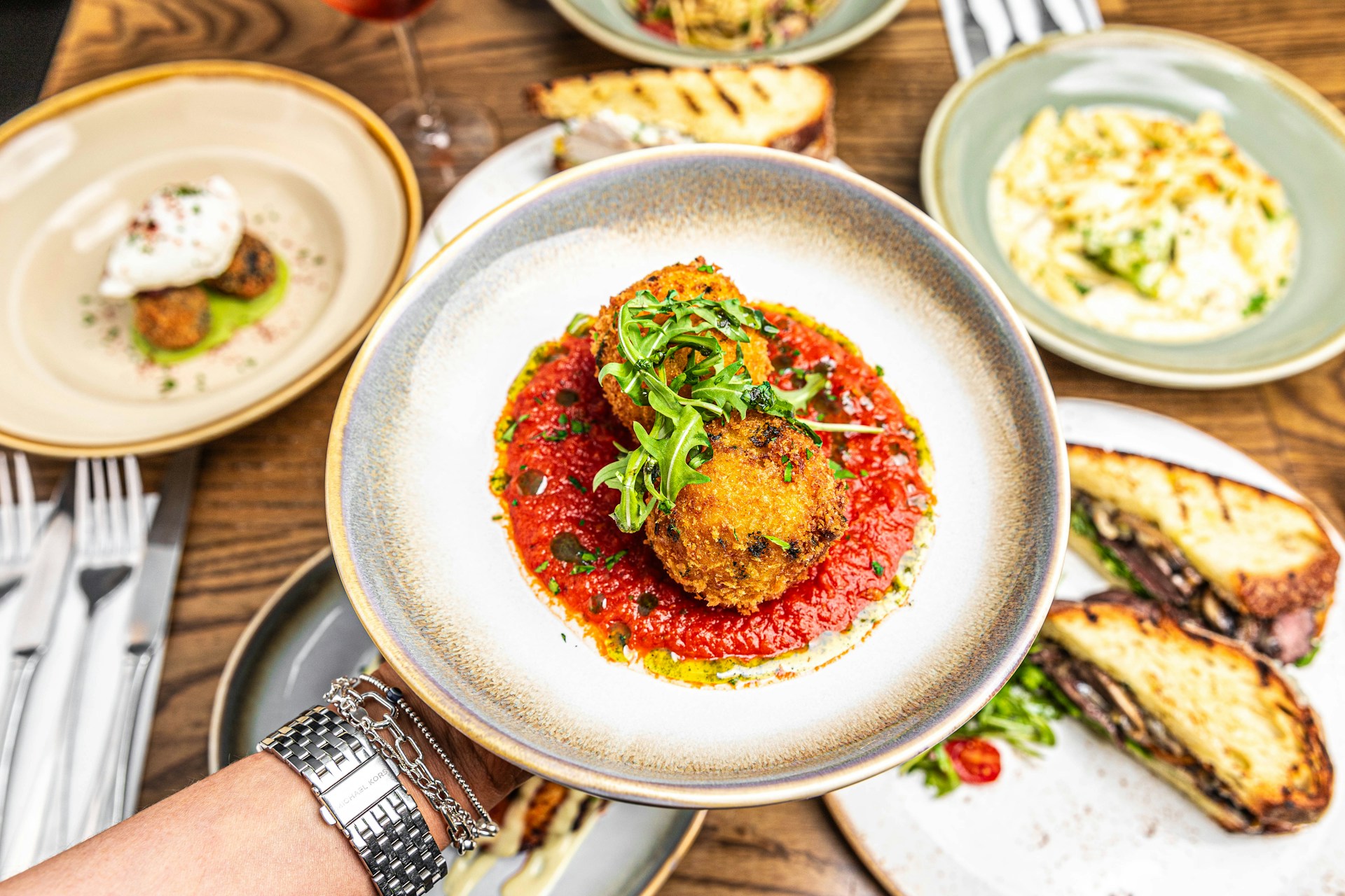 a person holding a plate with food on it