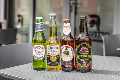 a group of bottles of beer sitting on top of a table