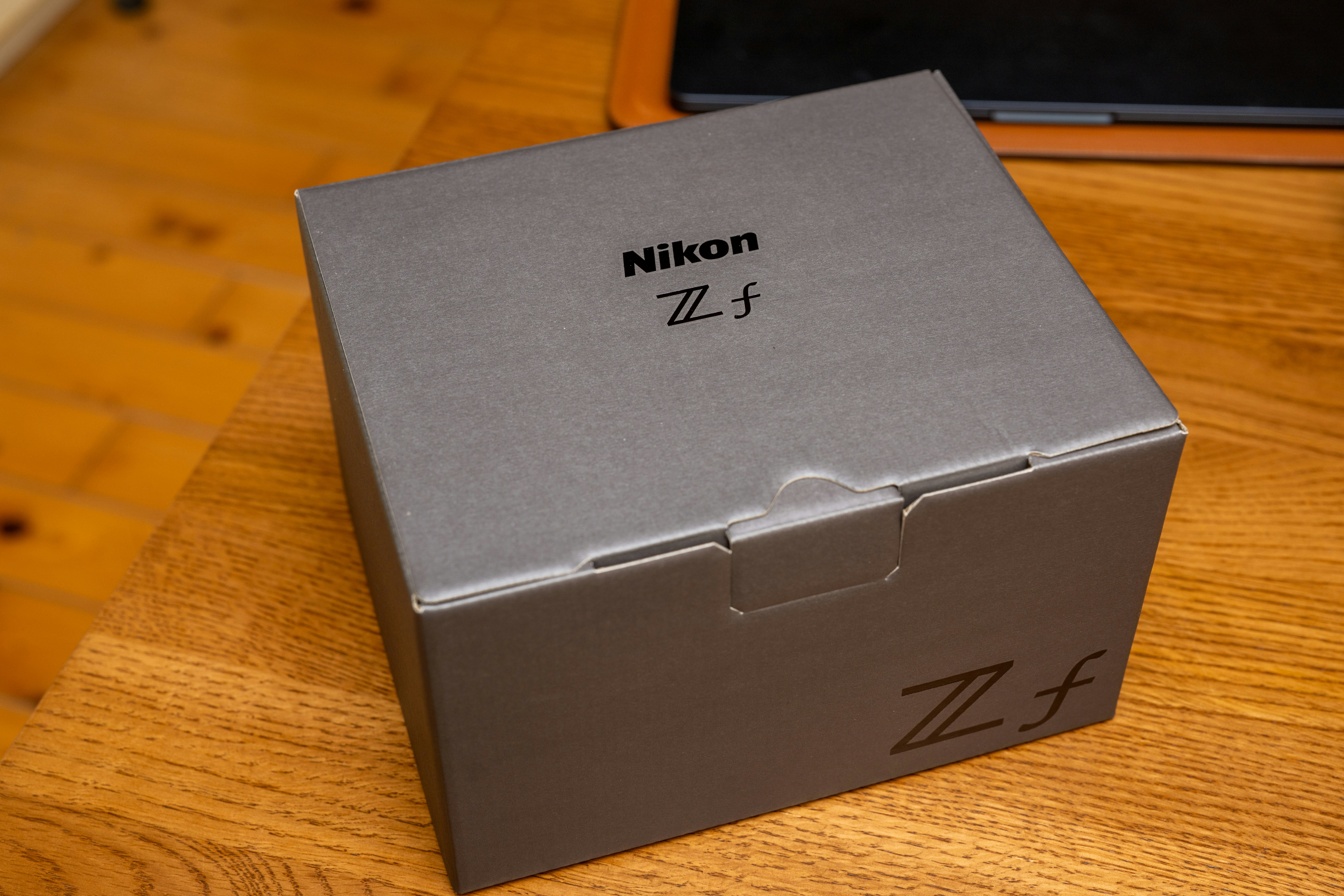 a box sitting on top of a wooden table