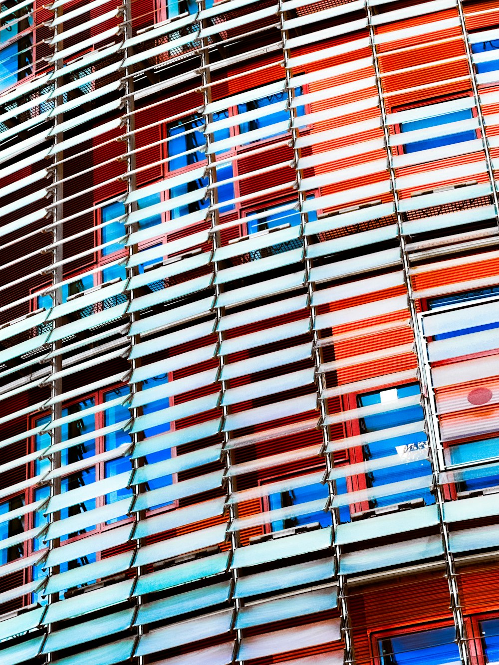 a multicolored building with a clock on the front of it