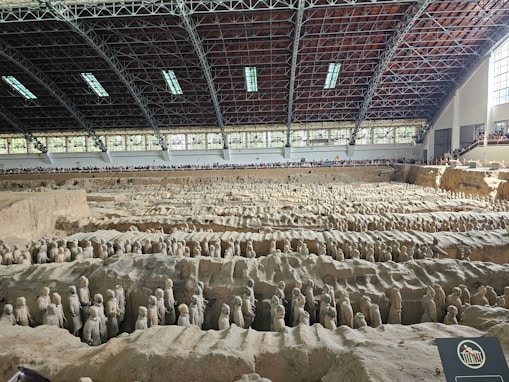 a large group of statues in a building