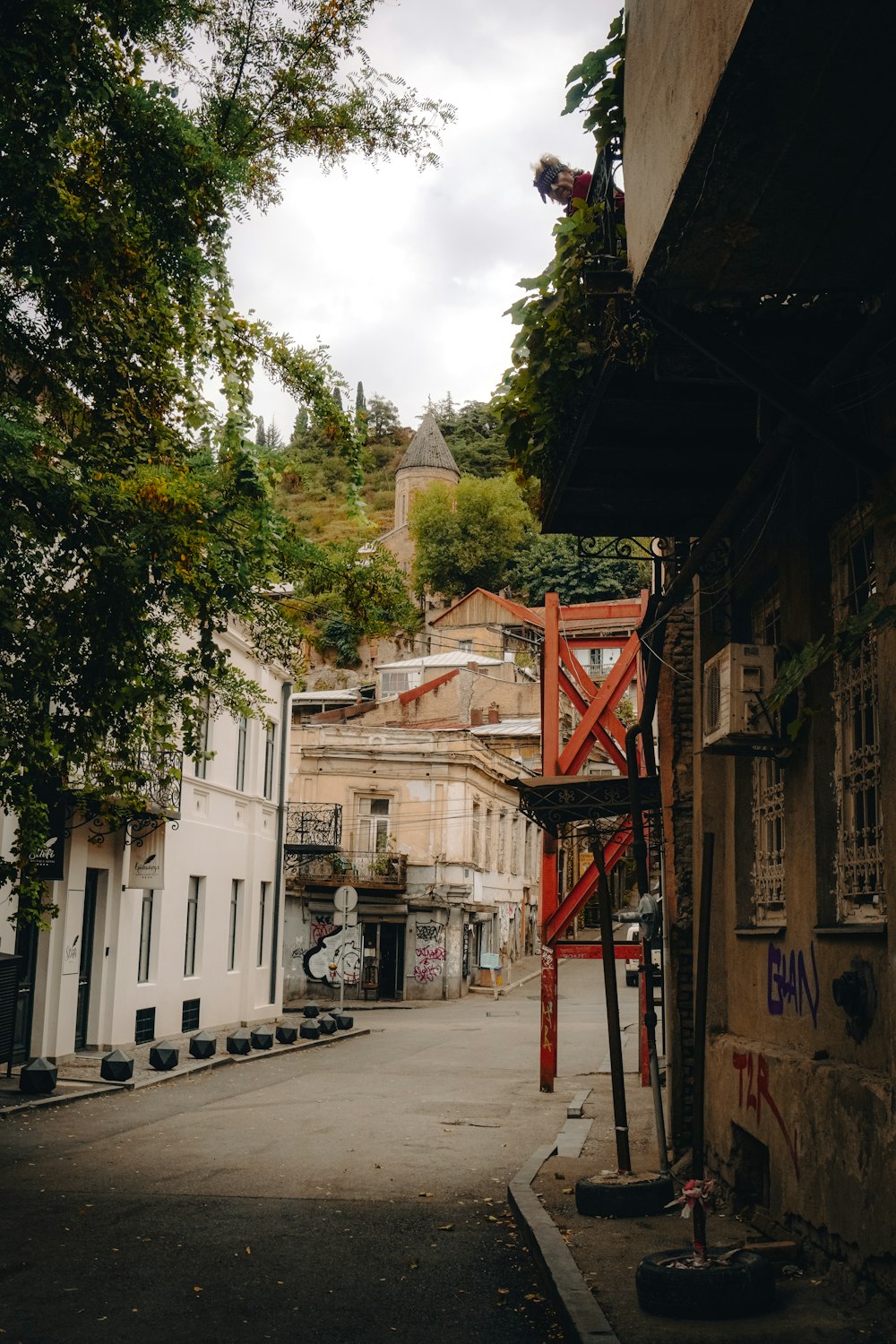 a narrow street with buildings on both sides