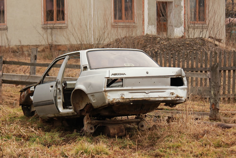 a car that is sitting in the grass