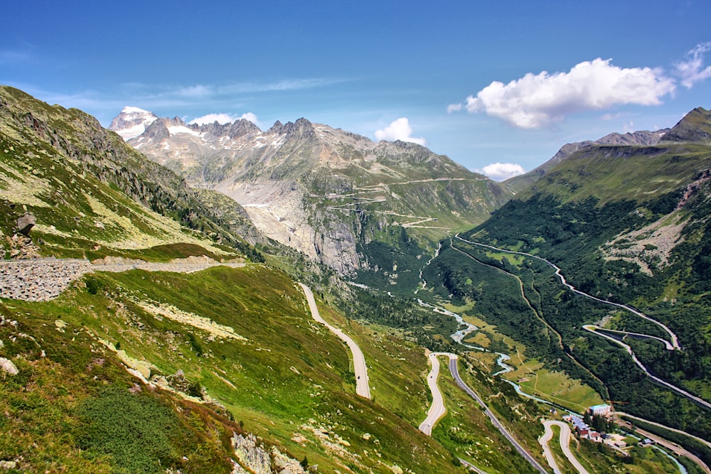 a view of a winding road in the mountains