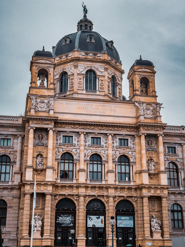The domed facade of the Kunsthistorisches Museum, with its dedicatory inscription above the entrance.