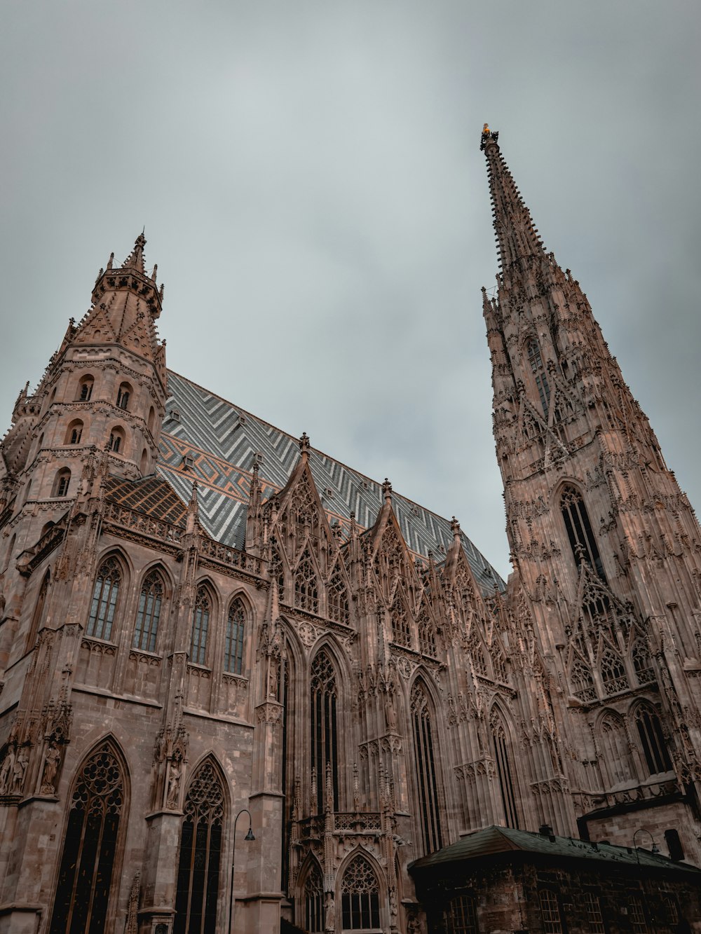 a large cathedral with a steeple on a cloudy day