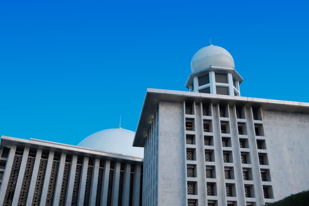 a tall building with a white dome on top of it