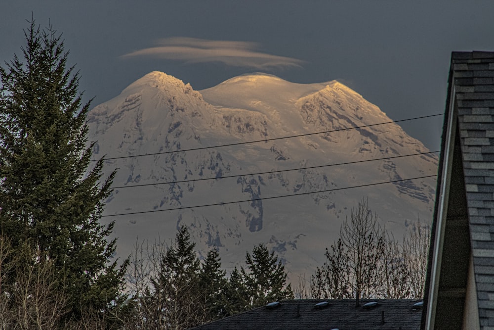 a view of a snow covered mountain in the distance