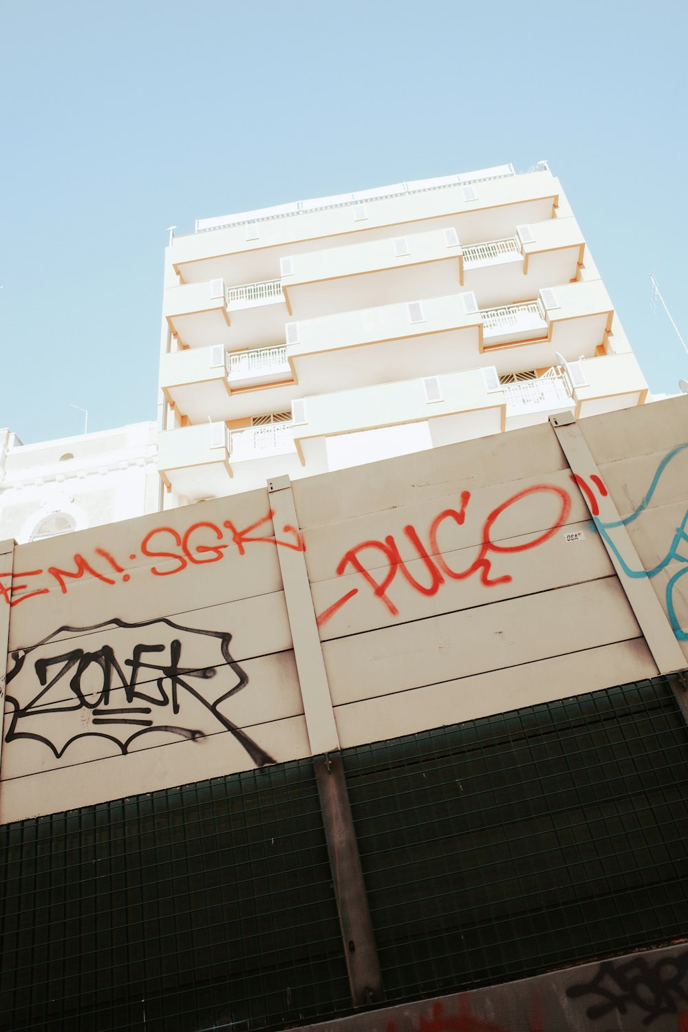 a tall building with graffiti on it's side