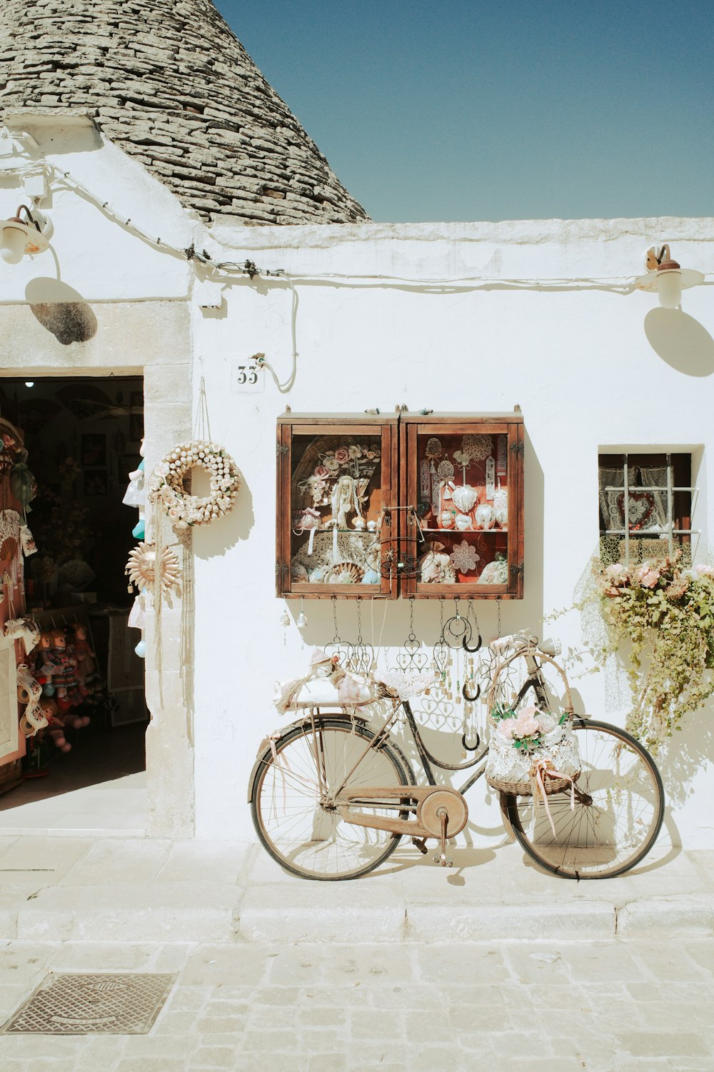 a bicycle parked in front of a white building