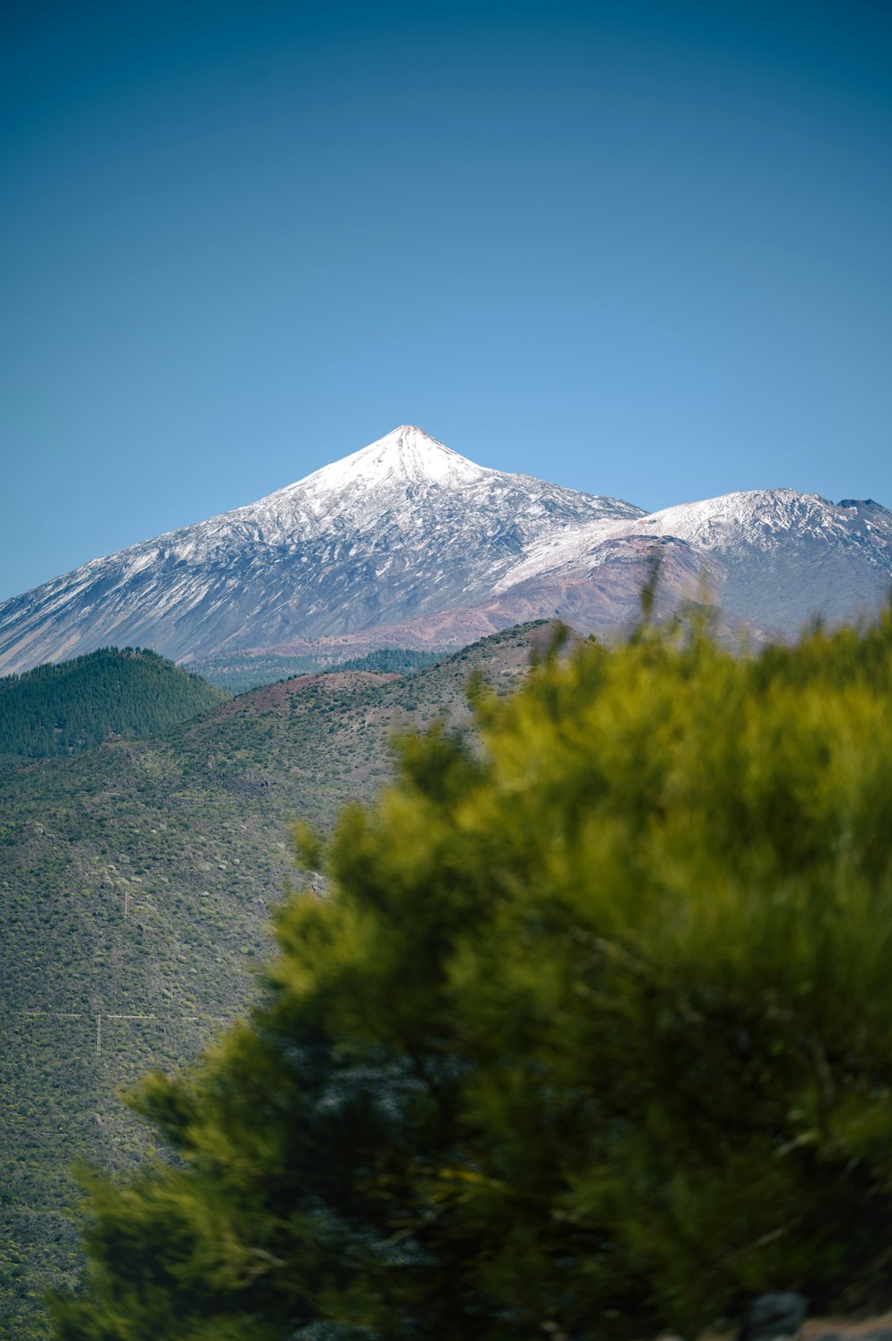 a view of a snow covered mountain from a distance