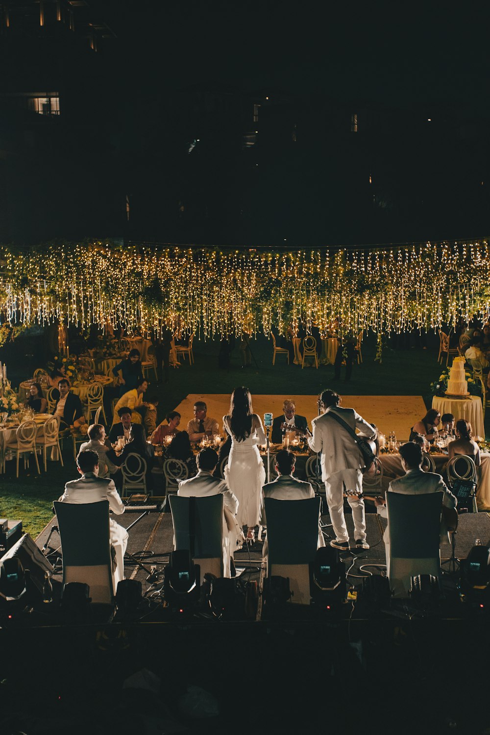 a group of people standing on top of a stage