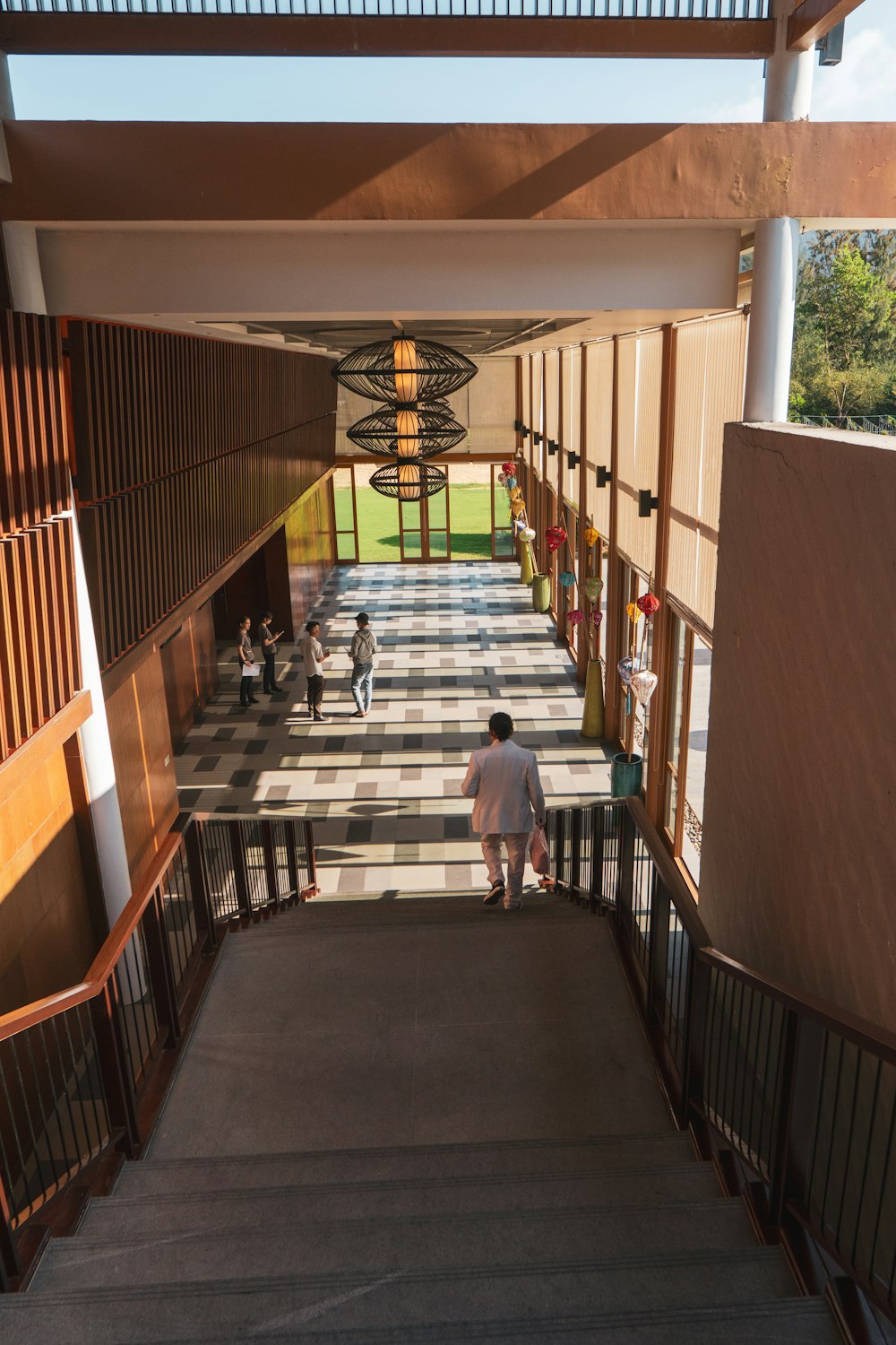 a man is walking down the stairs of a building