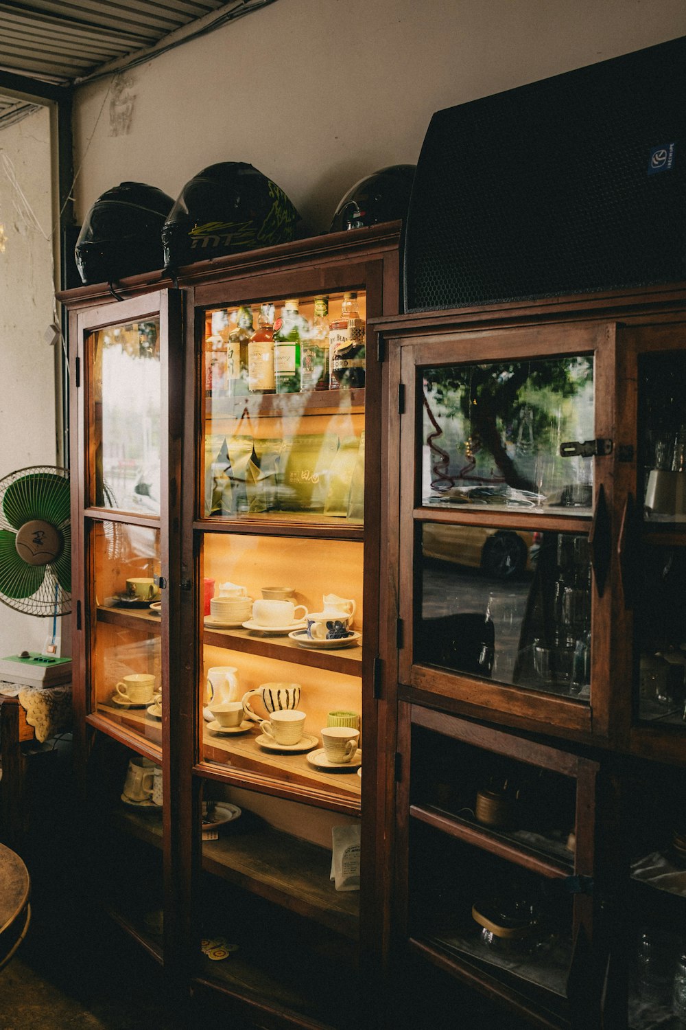 a display case with plates and bowls in it