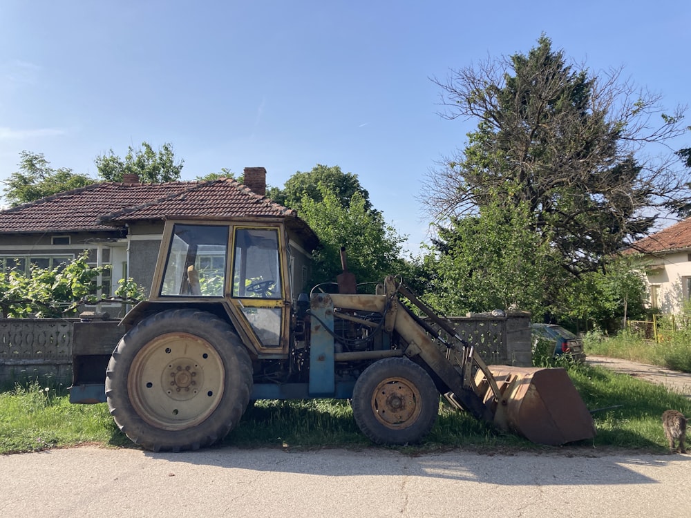 a tractor parked in front of a house
