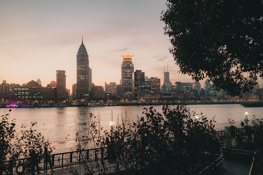 a large body of water with a city in the background