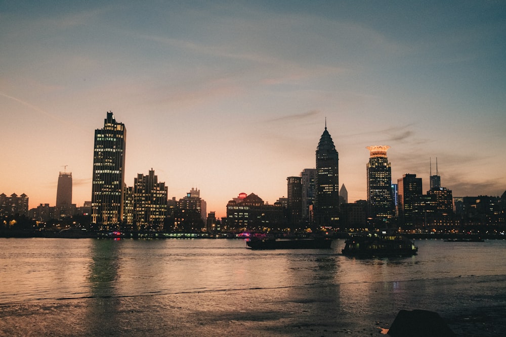 a large body of water with a city in the background