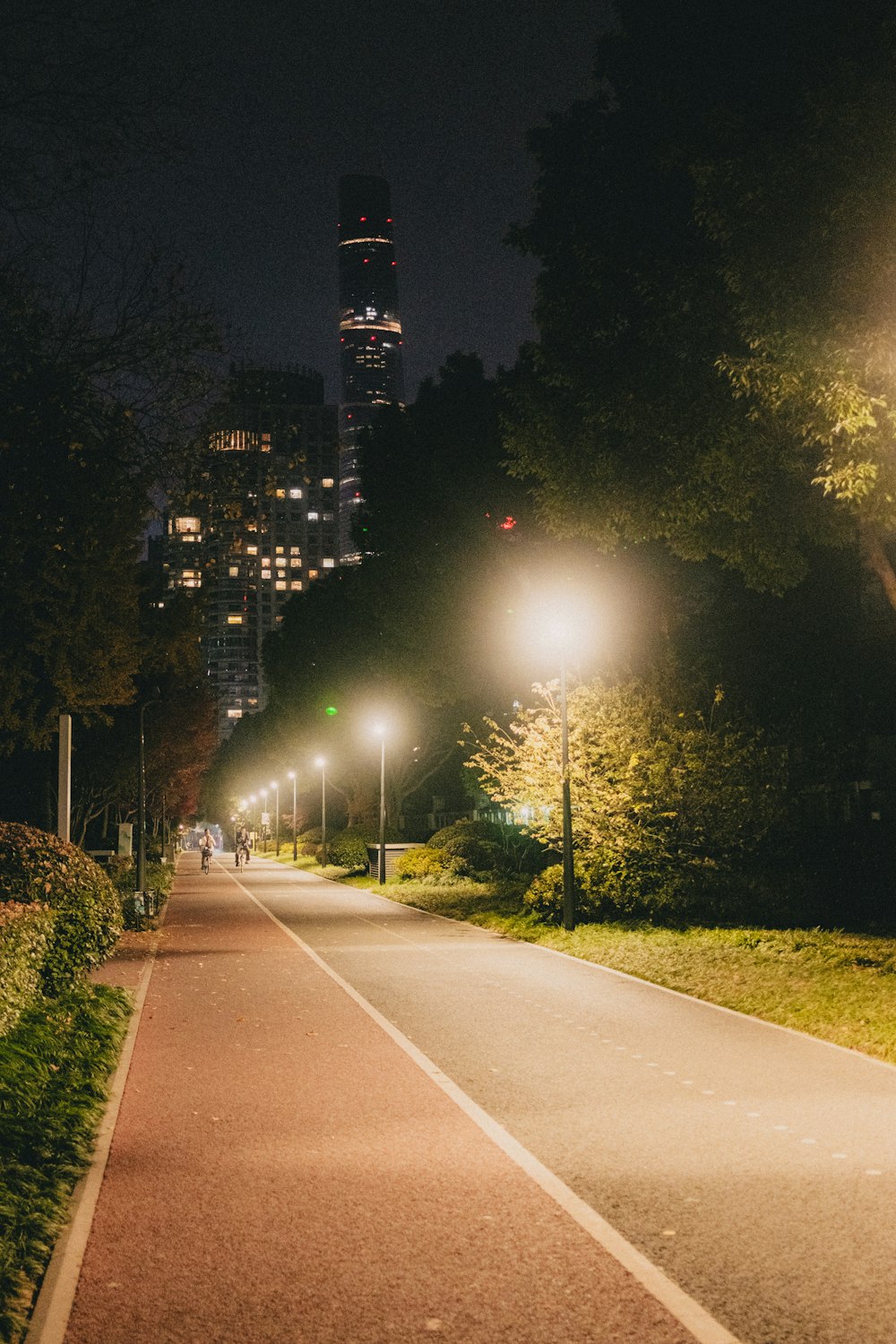 a city street at night with street lights