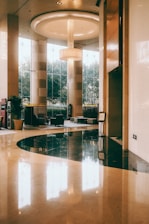a large lobby with a circular light fixture