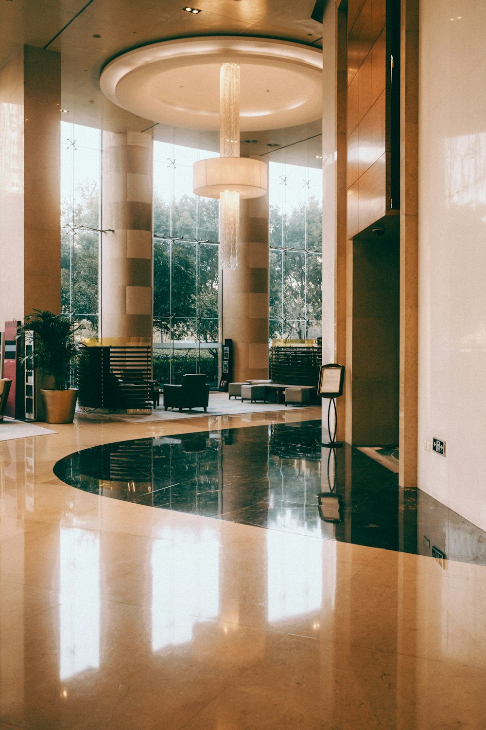 a large lobby with a circular light fixture