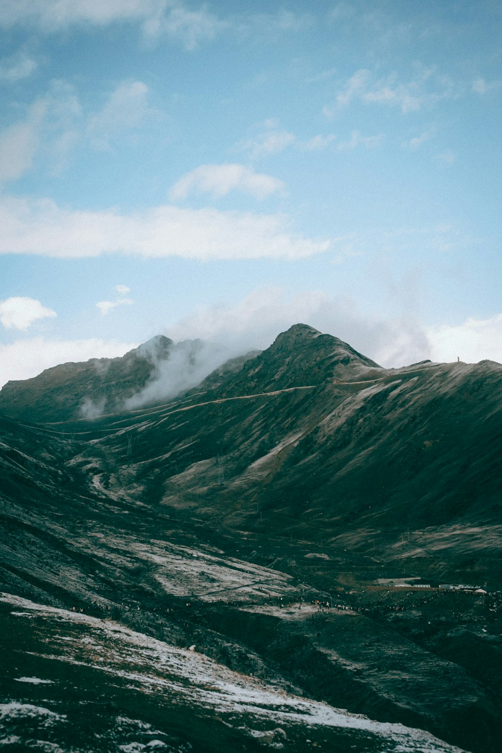 a view of a mountain with a road going through it