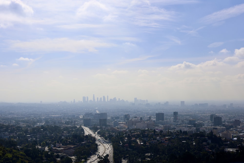 a view of a city from the top of a hill