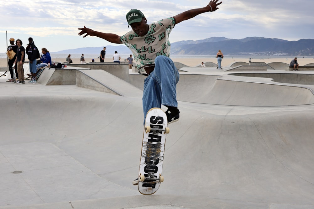 a man riding a skateboard up the side of a ramp