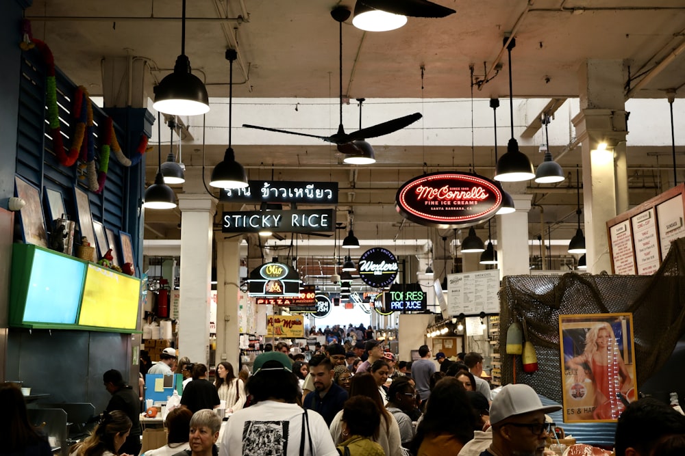 a group of people walking through a store