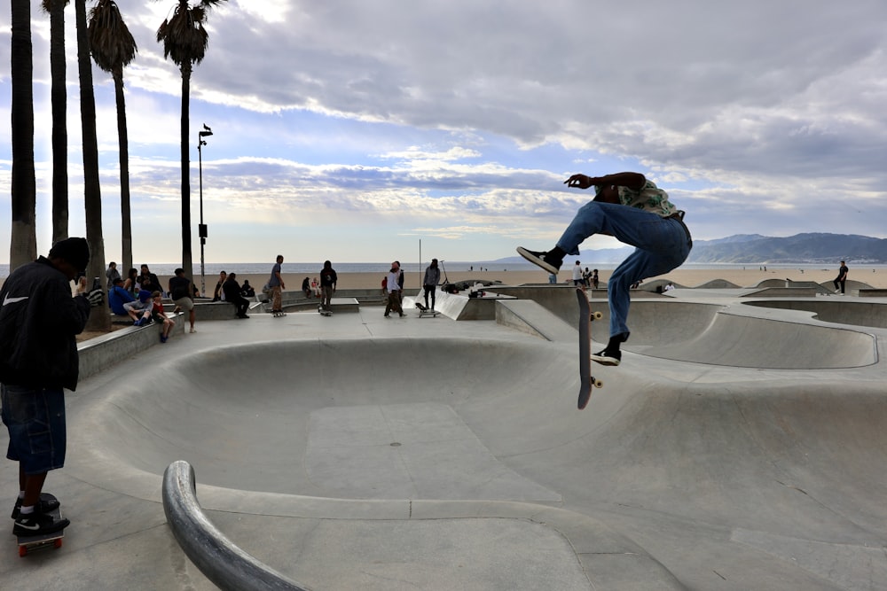 a man riding a skateboard up the side of a ramp