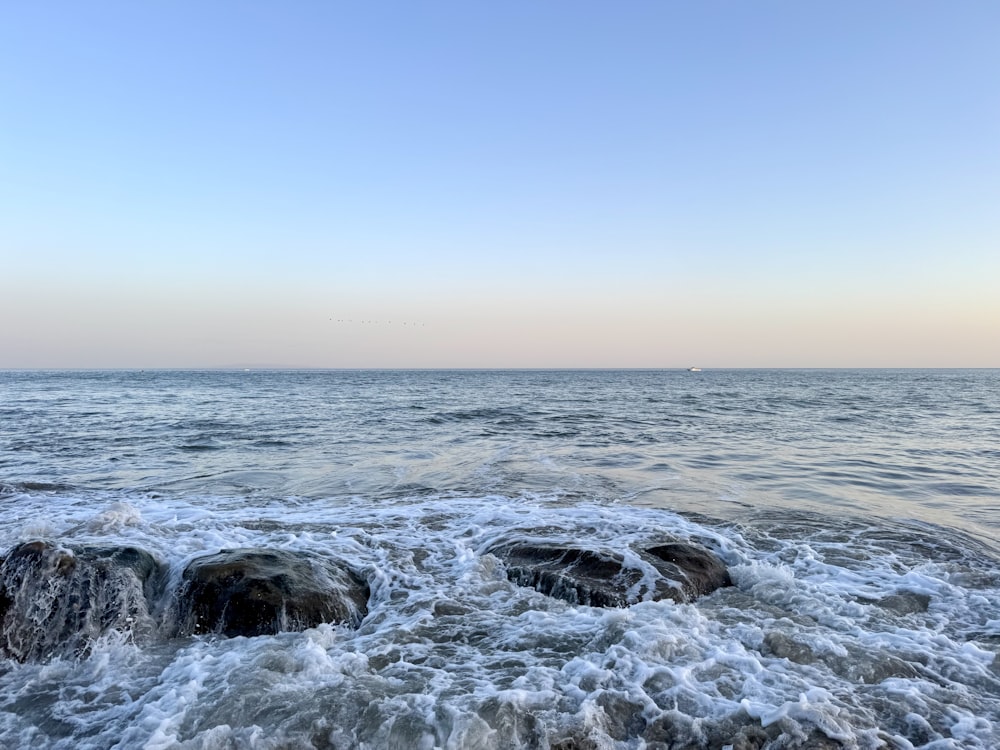 a body of water that has some rocks in it