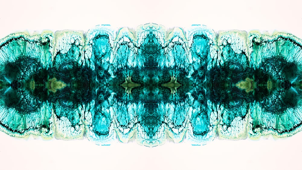 an abstract image of a green and blue flower