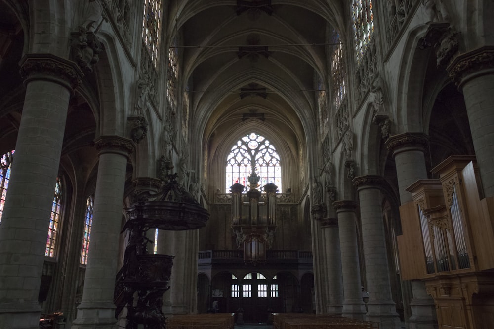 a large cathedral with high ceilings and stained glass windows