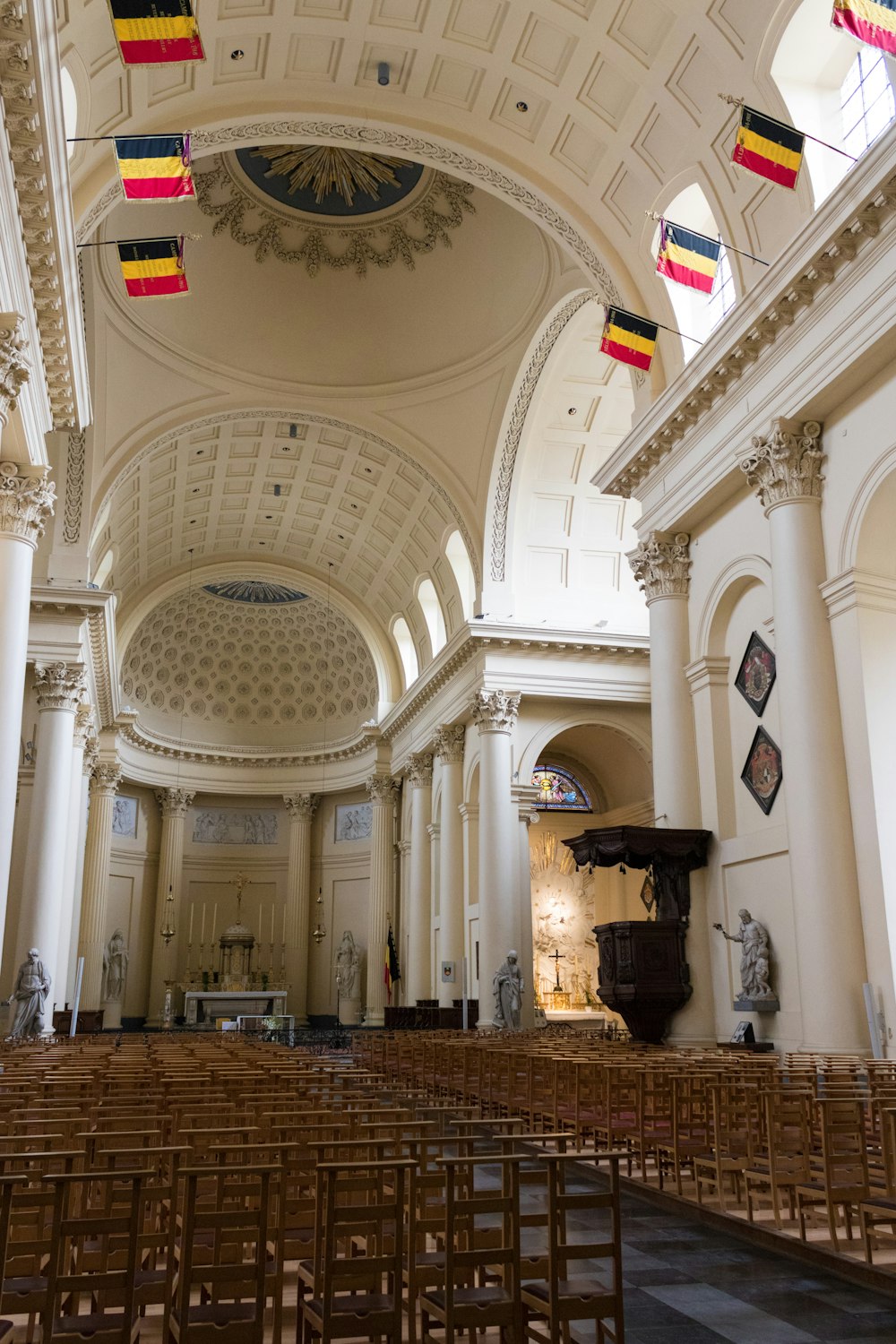 the interior of a church with rows of chairs