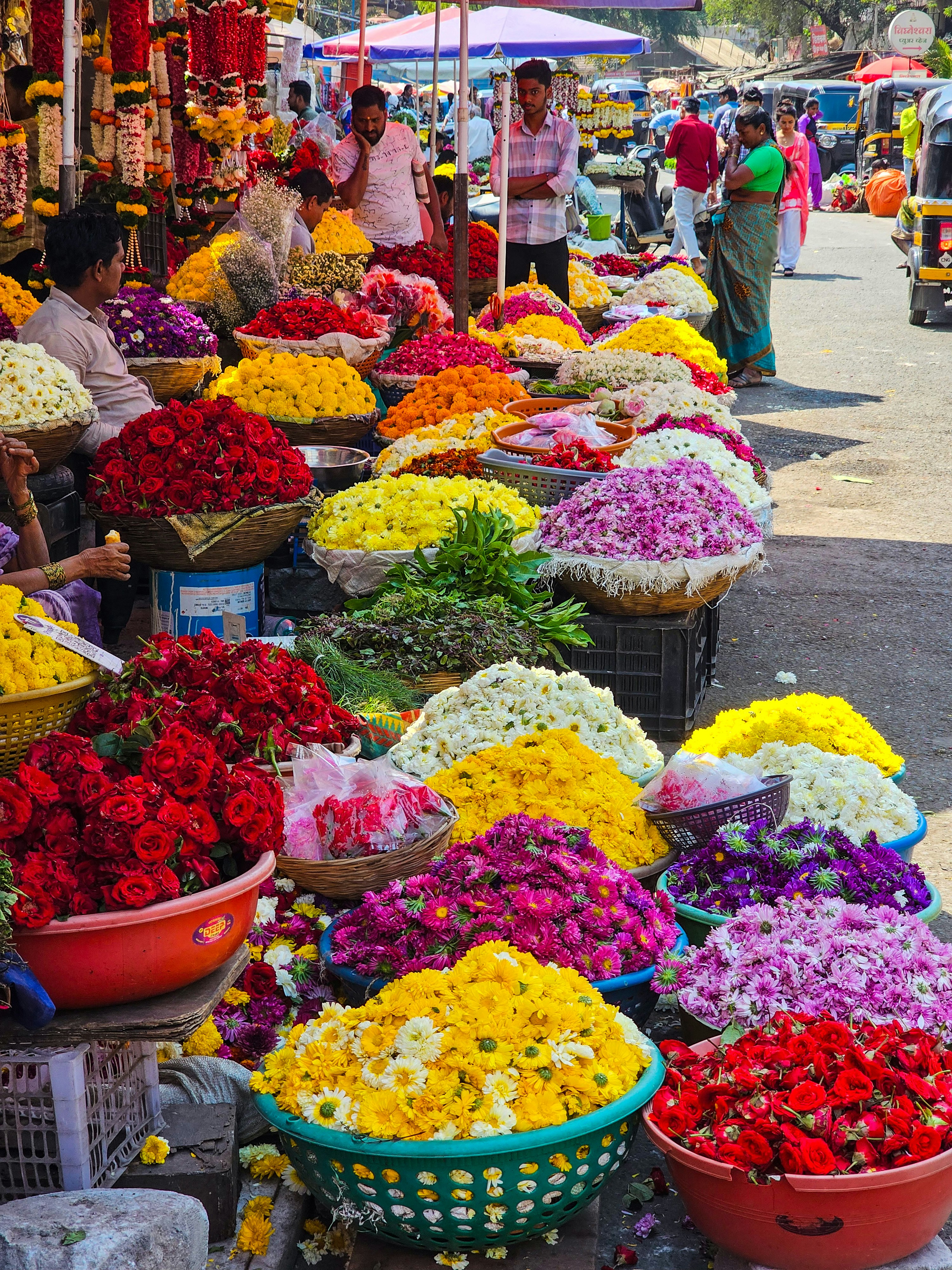 a bunch of baskets filled with lots of flowers