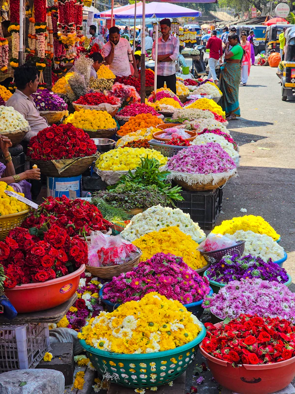 Baskets of fresh flowers at a market stall