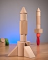 a stack of wooden blocks sitting on top of a wooden table