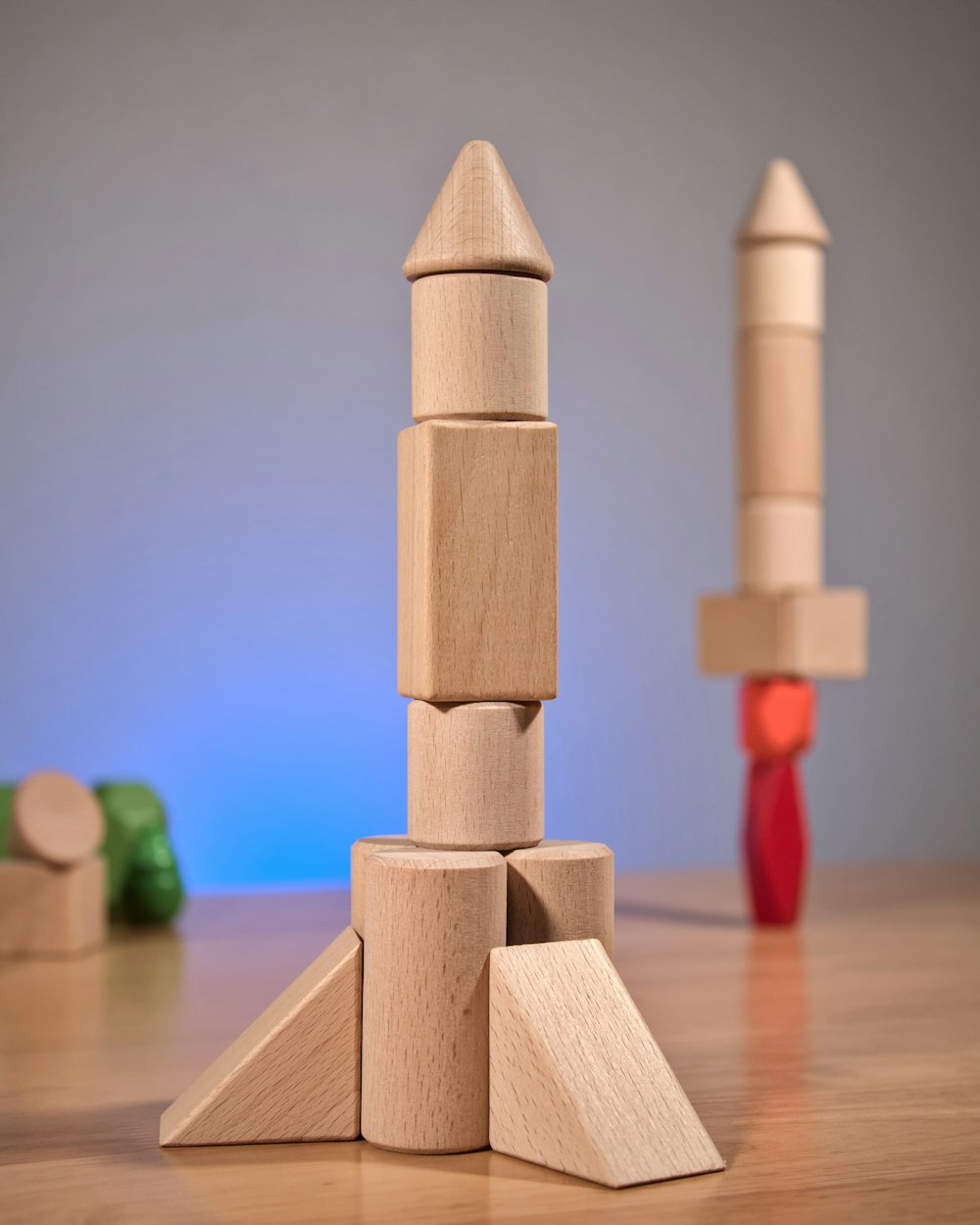 a stack of wooden blocks sitting on top of a wooden table