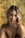 a woman in a black top is posing for a picture