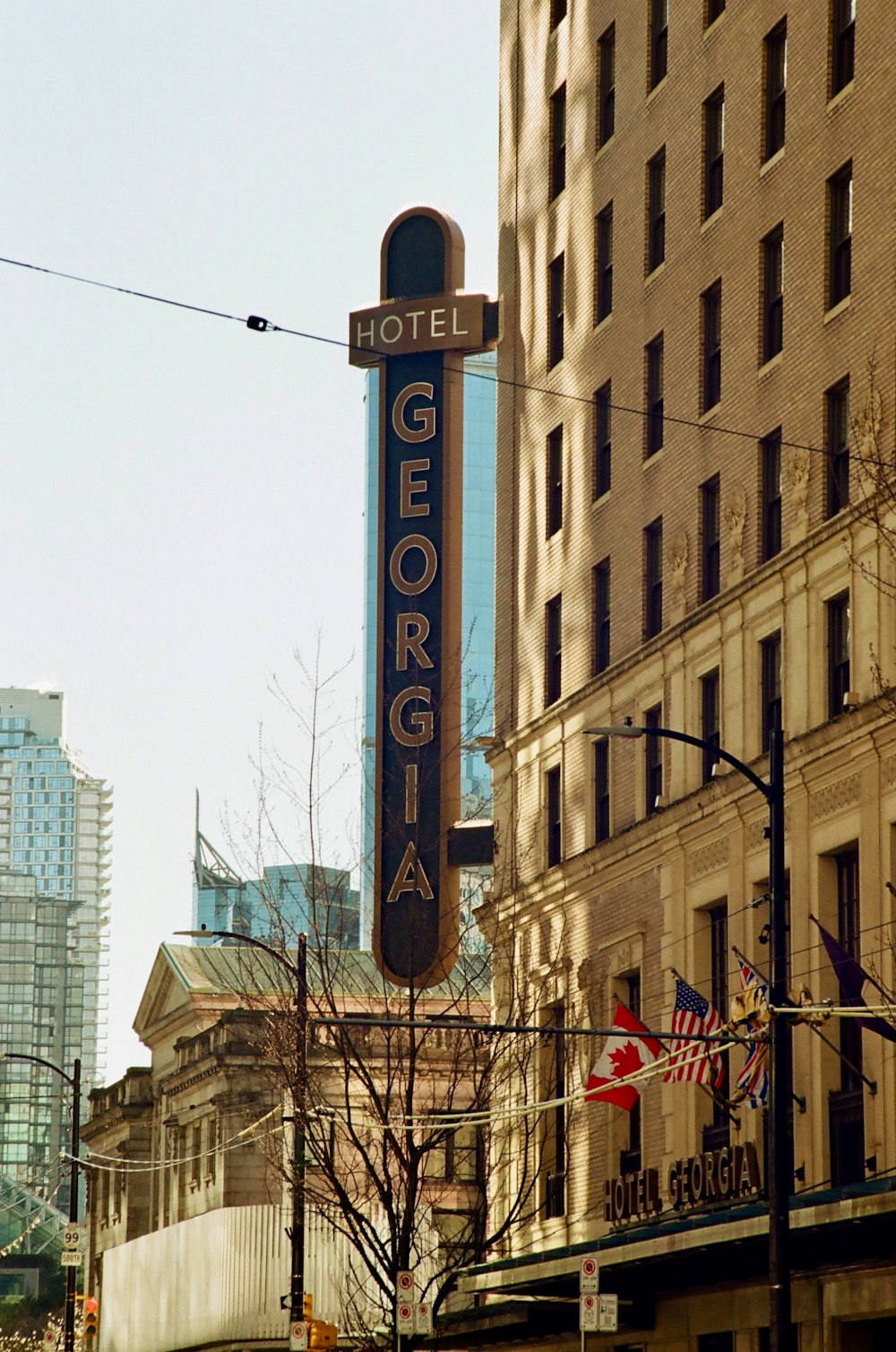 a hotel sign hanging off the side of a building