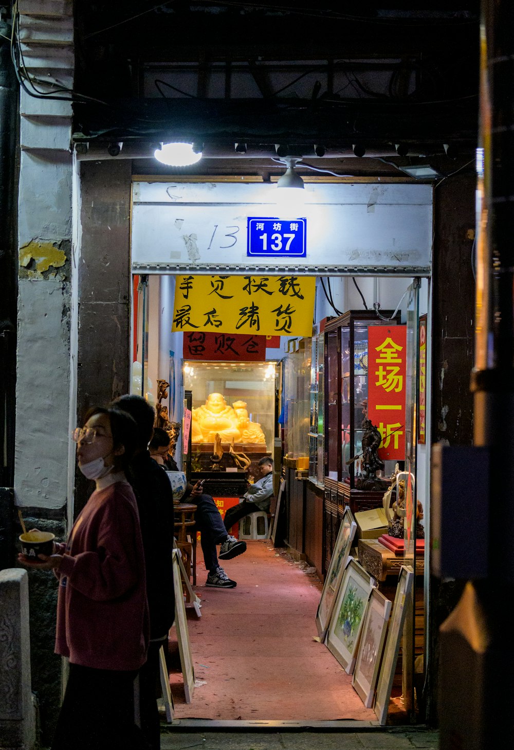 a woman standing in a doorway of a restaurant