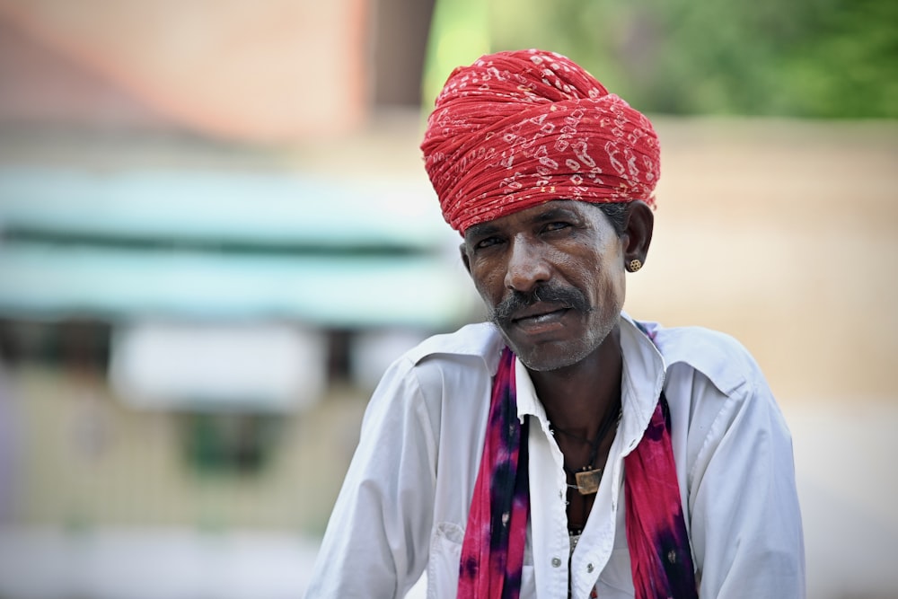 a man with a red turban on his head