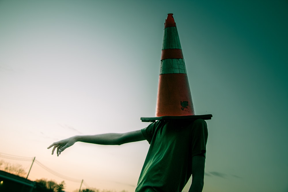 a person with a traffic cone on their head