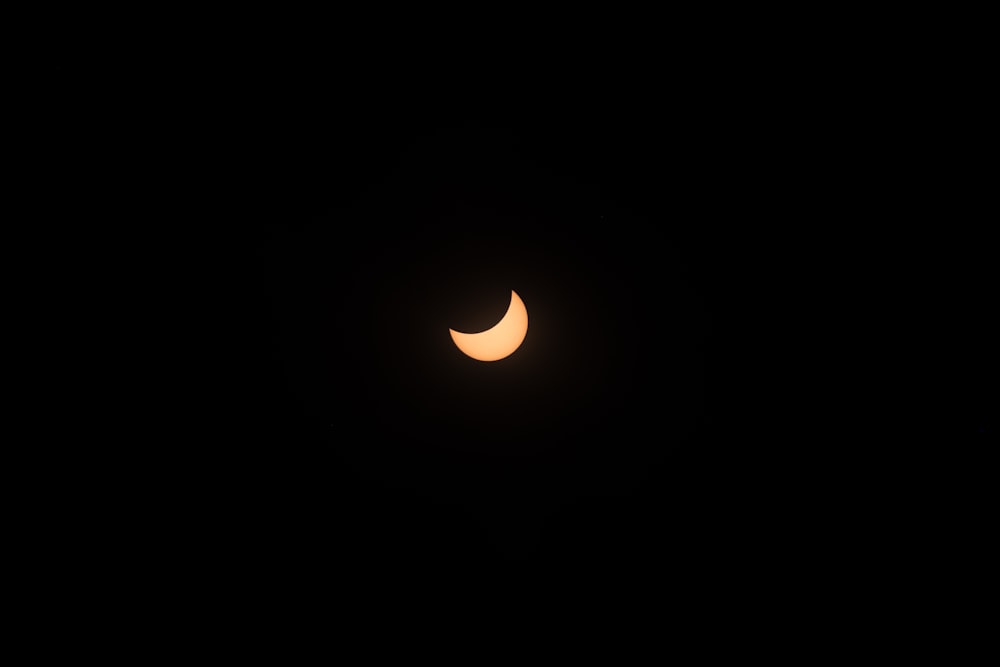 a partial solar eclipse seen through a telescope lens