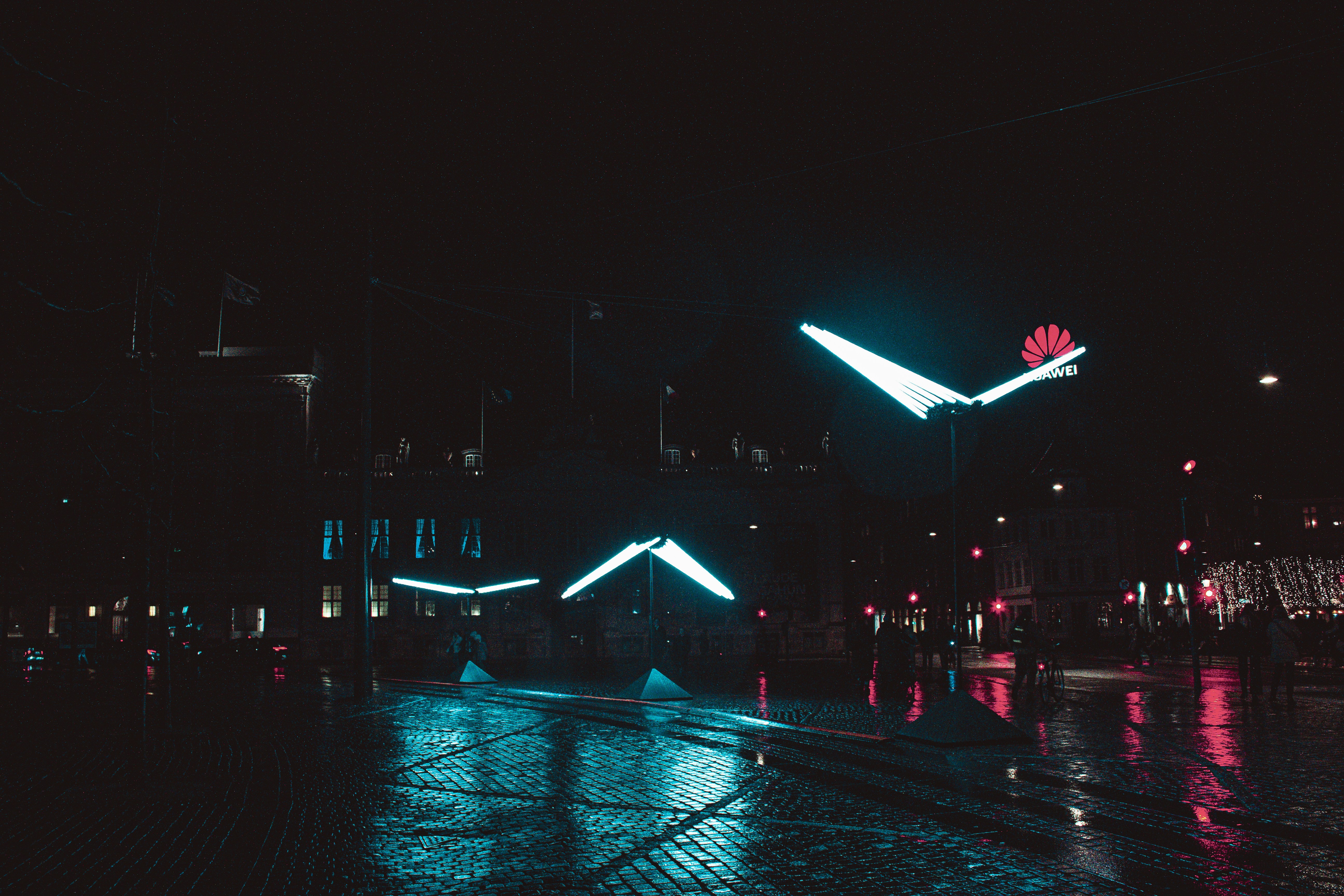 a city street at night lit up with lights